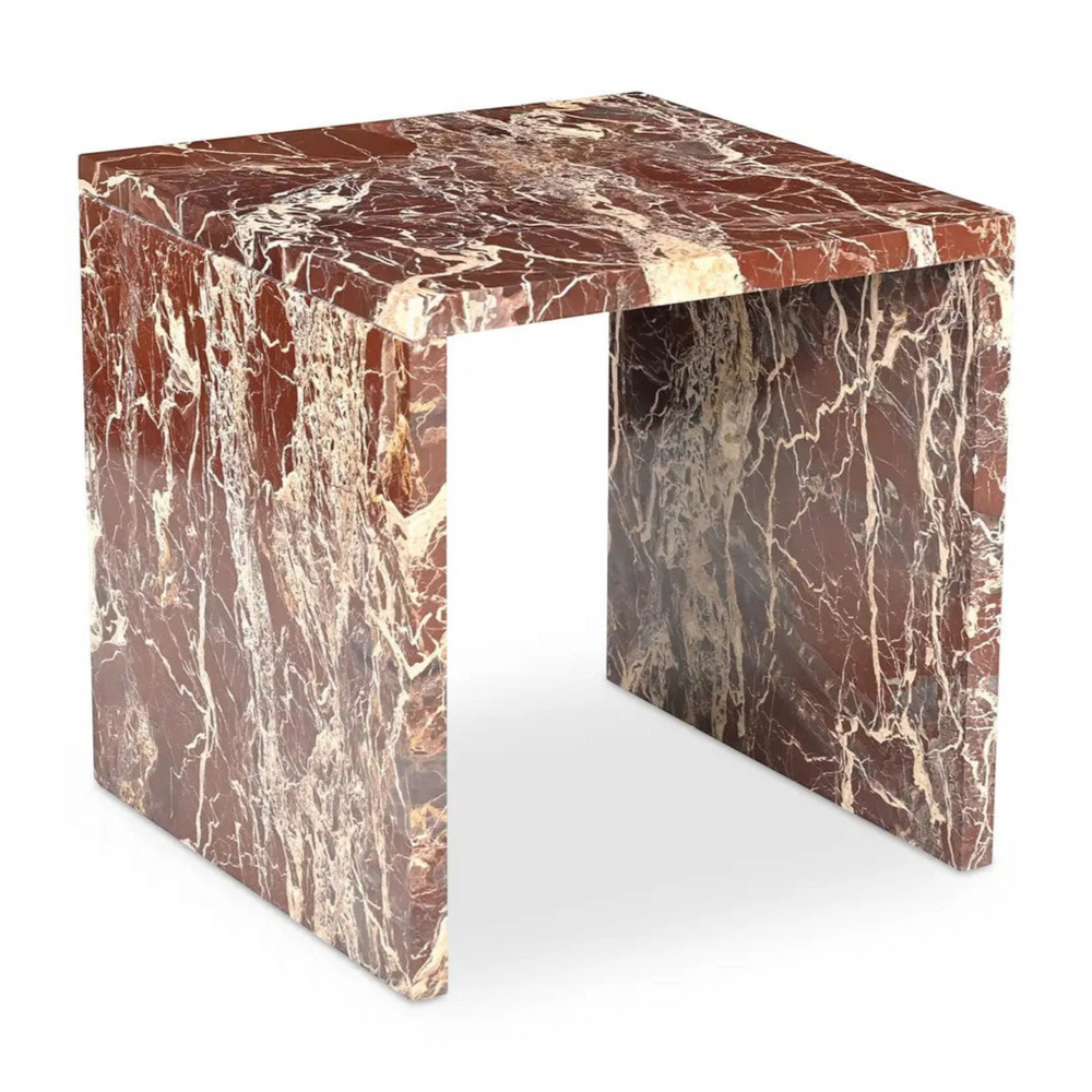 deKor Rosso Levanto marble accent table featuring a bold waterfall design with vibrant red stone and gold veining.