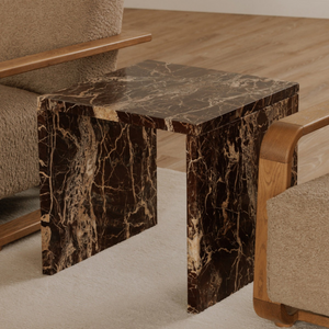 deKor Rosso Levanto marble accent table with a waterfall design, featuring deep red stone and intricate gold veining.