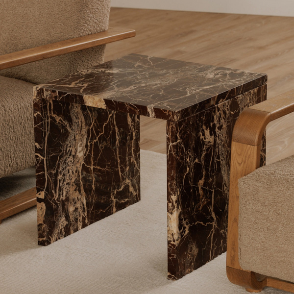 deKor Rosso Levanto marble accent table with a waterfall design, featuring deep red stone and intricate gold veining.