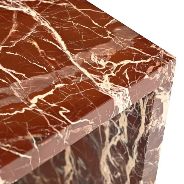 deKor Rosso Levanto marble accent table with a waterfall design featuring vibrant red stone and striking gold veining.
