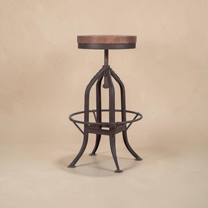 deKor rustic pedestal bar stool with a round wooden seat and adjustable height metal base in a dark finish