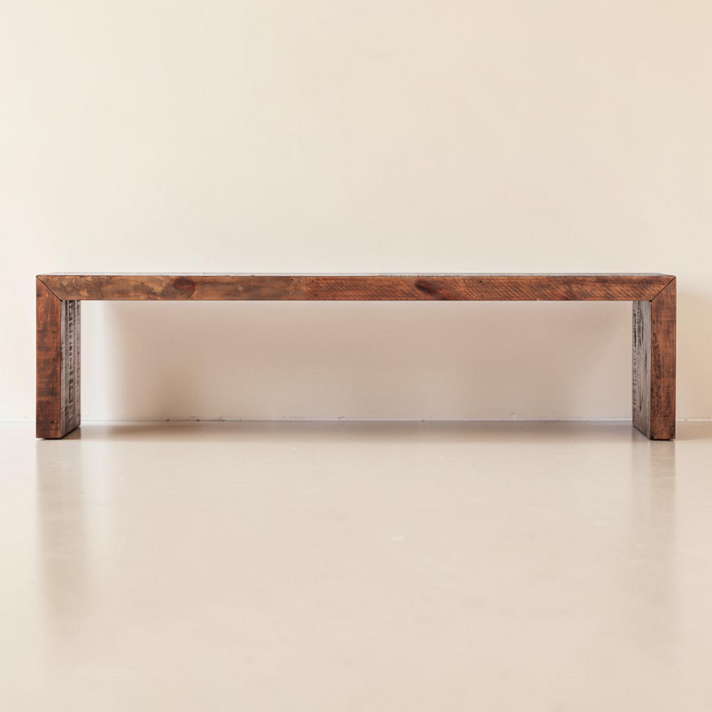 deKor salvaged large bench in light brown solid pine with a rustic finish and visible wood grain texture.