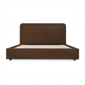 deKor Simon storage bed in brown fabric with a rounded headboard and piped detailing, front view.