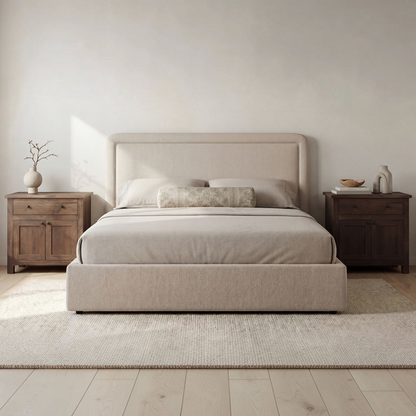 deKor Simon storage bed in beige fabric with a rounded silhouette and piped detailing in a minimalist bedroom