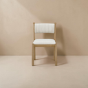 deKor Villetta dining chair featuring a warm stained wooden frame and white striped upholstered seat and backrest.