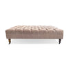 Tufted pink velvet ottoman with wood turned legs