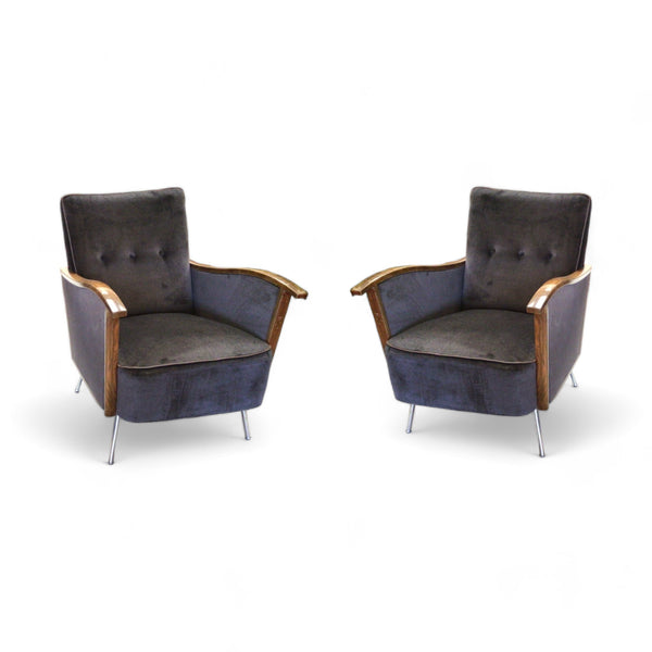 Dark blue-ish gray velvet arm chairs with wood trim on arms and metal legs 