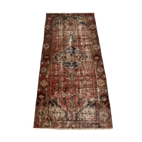 Distressed vintage accent rug in warm earthones
