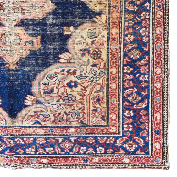 distressed vintage blue and red Persian rug 