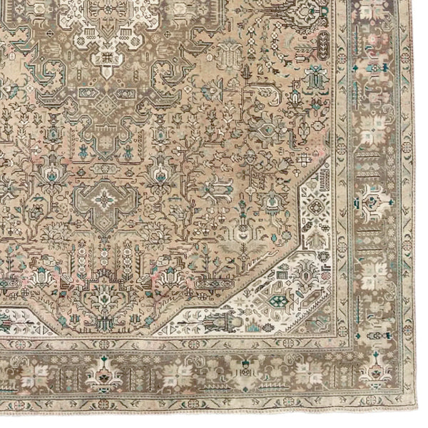 ornate earth toned vintage tabriz rug