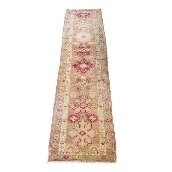 vintage moroccan runner rug with warm yellow background and pink traditional details