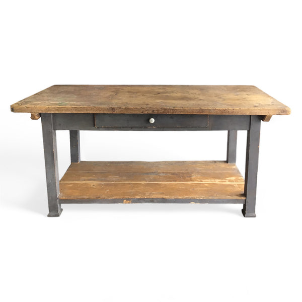 french farmhouse style work table with a drawer, lower shelf and distressed gray paint