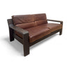 Two seater leather sofa with wooden base and arms