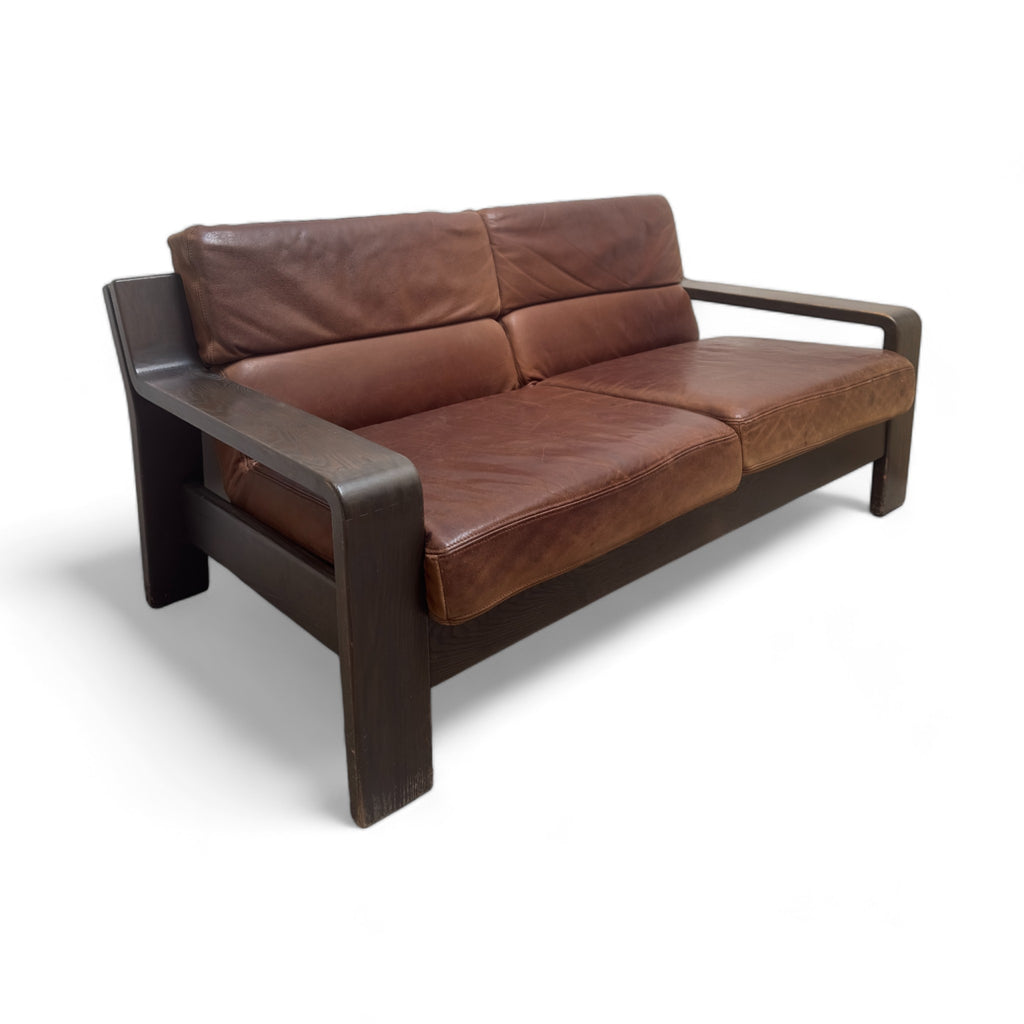 Two seater leather sofa with wooden base and arms