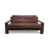 Two seater leather sofa with wooden base and arms