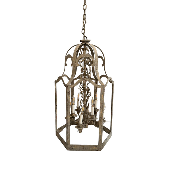 Wrought iron lantern style chandelier with leaf details.