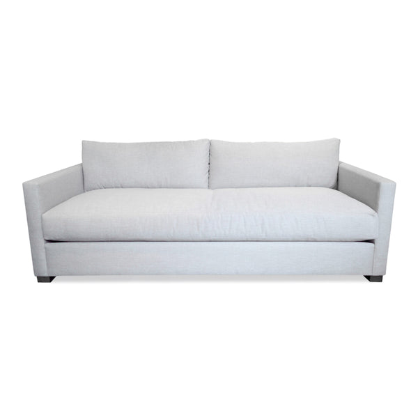 White tuxedo sofa made with performance grade upholstery and down alternative filled bench cushion