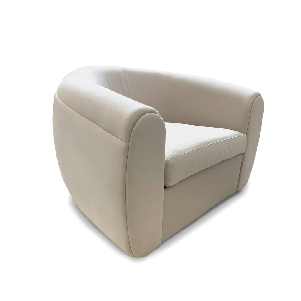 Modern swivel arm chair custom made to order by dekor in los angeles with rounded arms and low profile